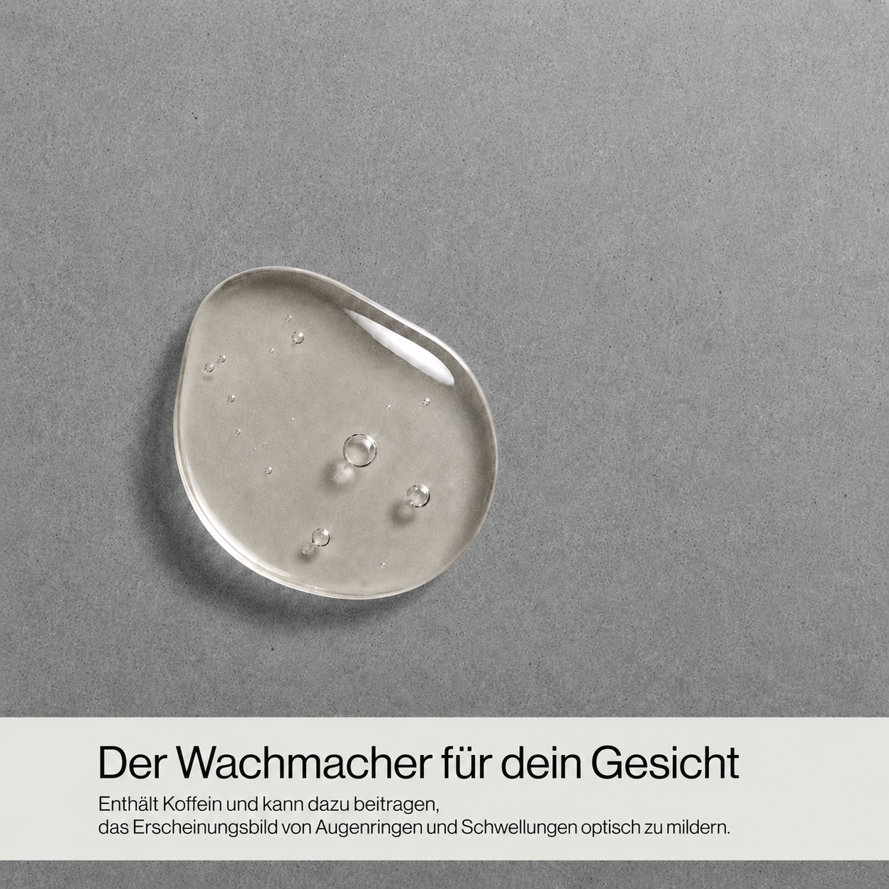 Nahaufnahme eines transparenten Gelkleckses auf grauem Untergrund mit Text 'Dein schneller Reset nach einem langen Tag Für die Anwendung auf Haar, Körper und Gesicht geeignet'