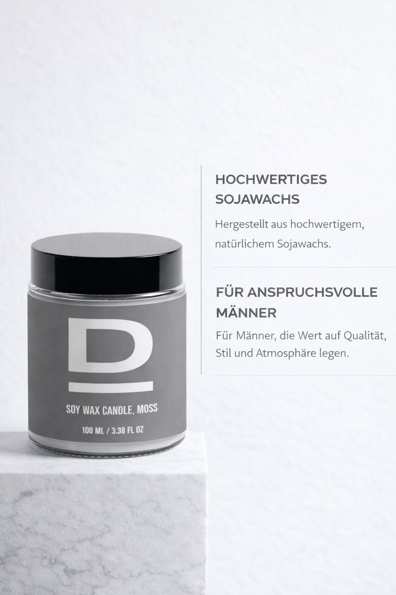 Kerze im Glas mit schwarzem Deckel und großem weißem Buchstaben "D" auf dem Etikett,