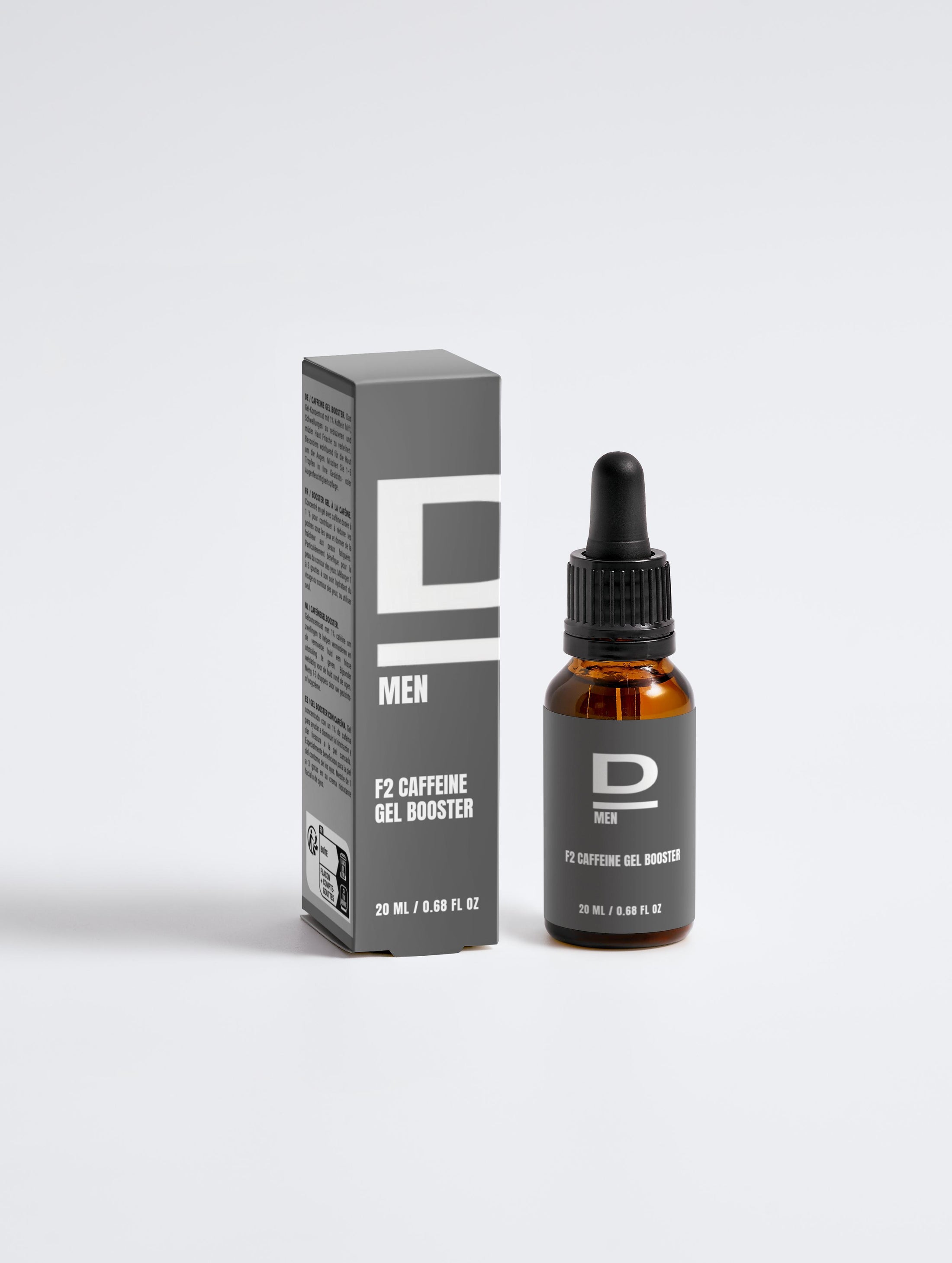 Braune Glasflasche mit Pipette und graue Verpackung mit der Aufschrift 'MEN F2 CAFFEINE GEL BOOSTER'.