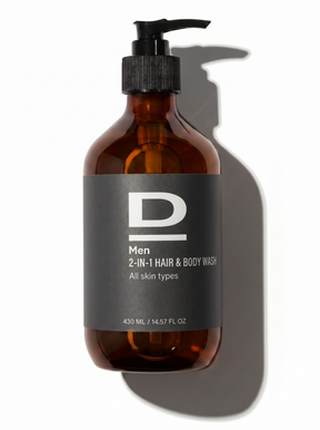 Braune Flasche mit schwarzem Pumpverschluss und grauem Etikett mit der Aufschrift 'D Men 2-IN-1 HAIR & BODY WASH All skin types 430 ML / 14.57 FL OZ'