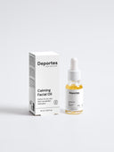 Flasche mit Pipette für Gesichtsöl, beschriftet mit 'Deportes' und 'Nourishing Facial Oil', 30 ml, transparentes Glas, orangefarbene Flüssigkeit.