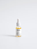 Flasche mit Pipette für Gesichtsöl, beschriftet mit 'Deportes' und 'Nourishing Facial Oil', 30 ml, transparentes Glas, orangefarbene Flüssigkeit.