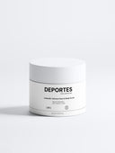 Runder, weißer Behälter mit schwarzem Text. Aufschrift: 'Deportes Icelandic Volcano Face & Body Scrub'. Inhalt: 170 ml.