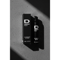 Aufrecht stehende schwarze Verpackung und Flasche mit weißer Aufschrift 'D MEN OIL-FREE ZINC FACE GEL FOR MEN 50 ML / 1.69 FL OZ' auf grauem Untergrund mit Schatten